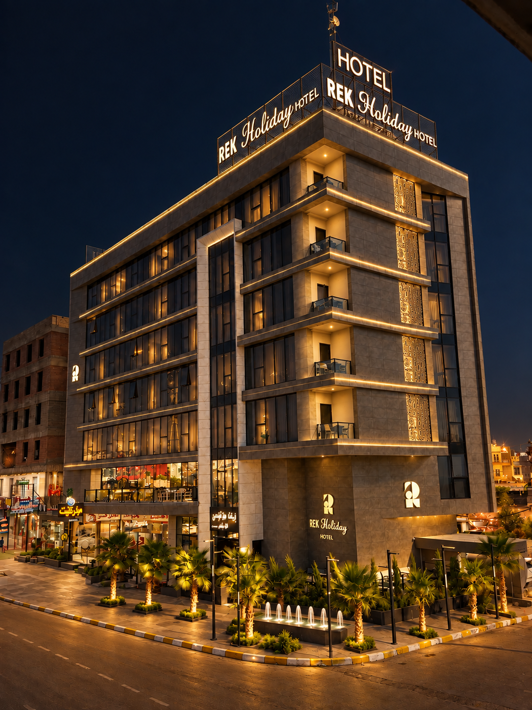 REK Holiday Hotel exterior at night